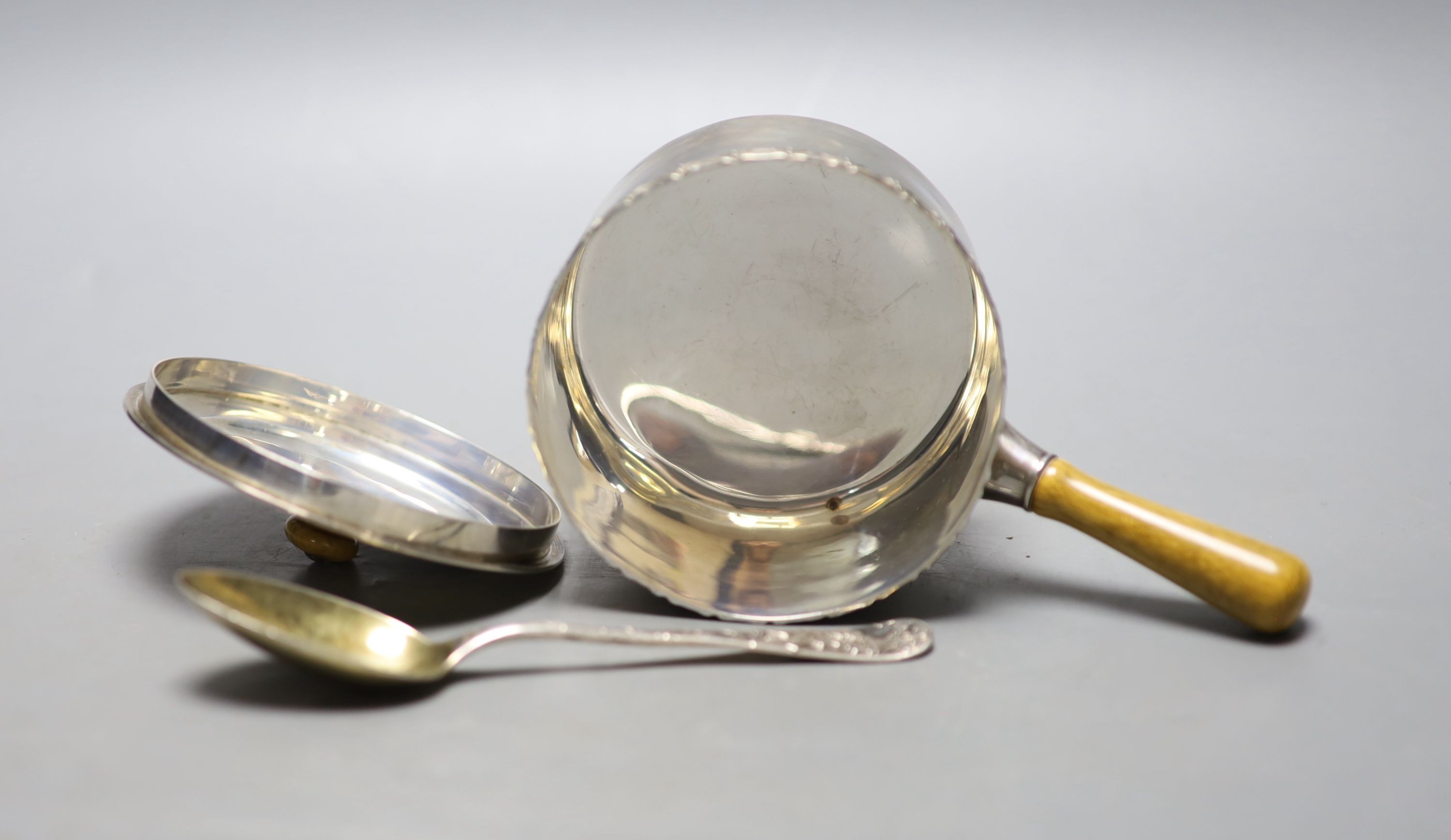 A late 19th/early 20th century Tiffany & Co sterling brandy warmer? and cover, length 16.7cm, and a Tiffany & Co sterling spoon, gross weight 8.5oz.